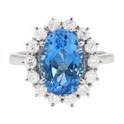 18ct white gold oval cut Swiss blue topaz and round brilliant cut diamond cluster ring, hallmarked