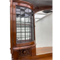 Late Victorian walnut mirror back sideboard or dresser, the raised back fitted with two curved and lead glazed cabinets, central arched bevelled mirror, the sideboard with break bowfront, fitted with six drawers and two cupboards, the cupboard doors panelled and carved with scrolls, shell and plant motifs, shaped apron with cabriole feet
