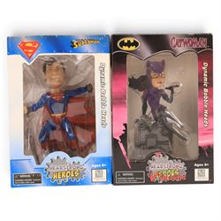 Four Monogram Headstrong Heroes bobble heads, comprising Superman, The Riddler, Catwoman and Robin, together with a DC Direct Deluxe Action Figure Set, DC DIrect Hush The Riddler figure and a Mattel Batman & Superman figure pack, all boxed