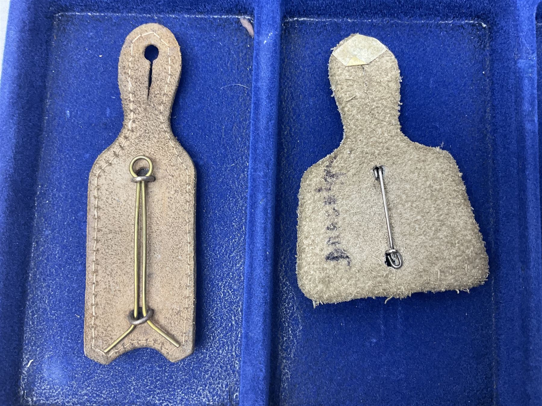 Twelve French military metal badges mounted on leather fobs including Legion, Artillery, Parachutist, Air Force, Infantry etc