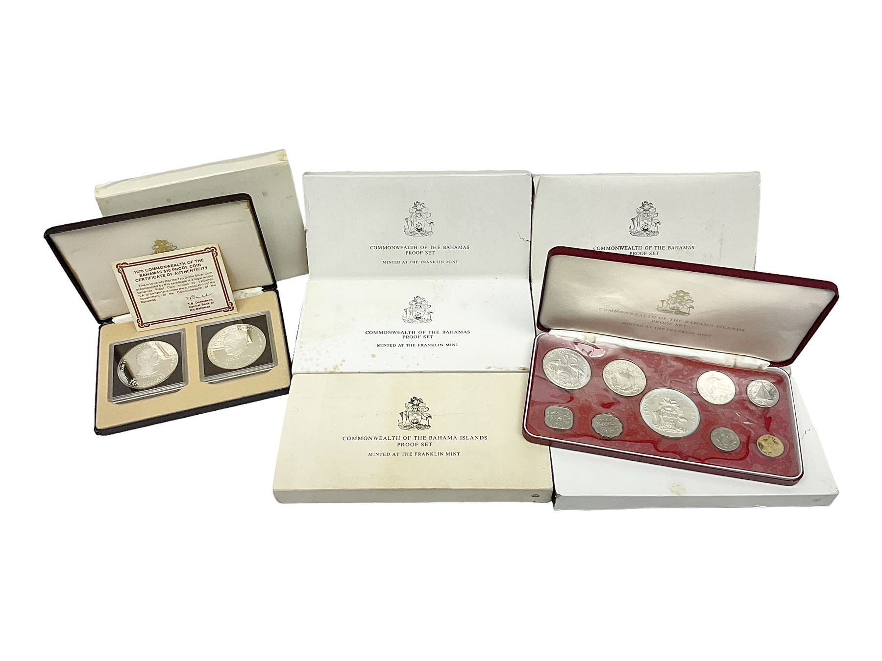 Six Commonwealth of the Bahamas Islands nine coin sets, dated 1972, 1973, 1974, 1975, 1976 and 1979, all minted at the Franklin Mint and containing high denomination silver coins, all cased, and a Bahamas Anniversary 1978 two coin set comprised of two silver proof ten dollar coins, cased 