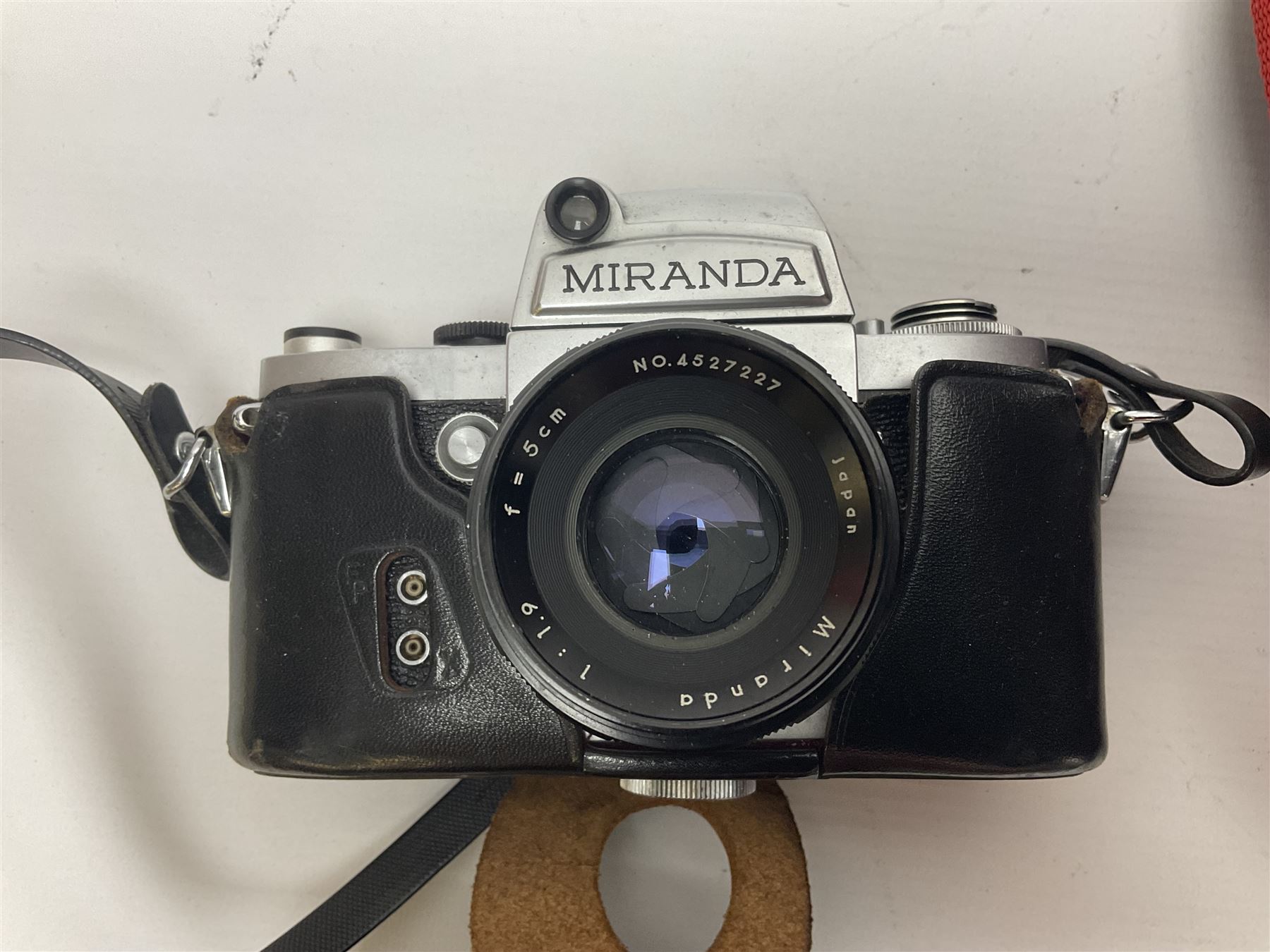 Cameras and accessories, to include Olympus OM101 Power Focus camera body, serial no 1076067, with 'Sigma AF Zoom 1:38, f=75 200mm' lens, serial no 2053714, Canon EOS 5000 camera body, serial no 1507812, with 'Canon Zoom EF 80-200mm, 1:4.5-5.6' lens, other cameras, by Miranda, Coronet and Ricoh and a collection of lenses, carry cases, etc 