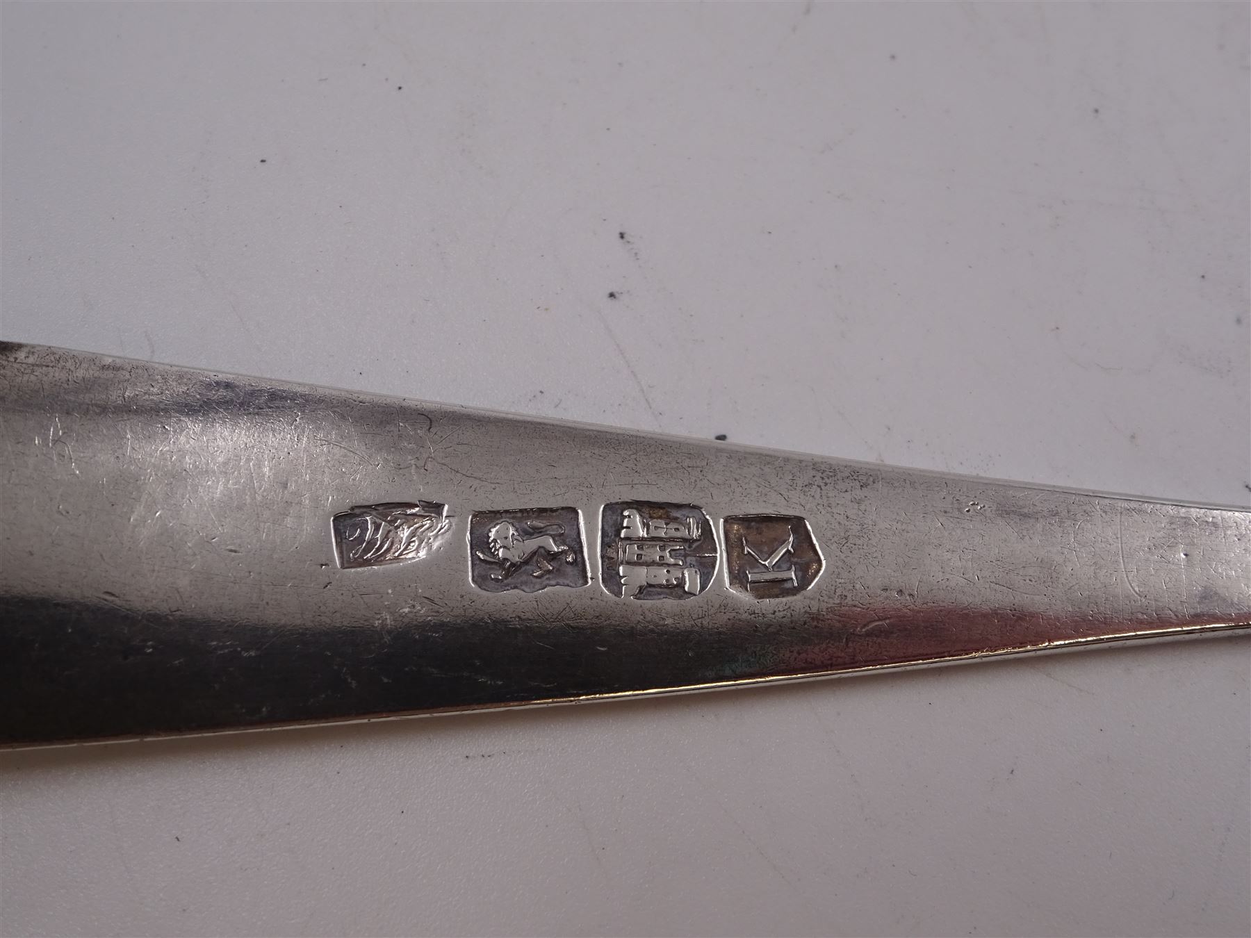 George III Exeter silver Old English pattern table spoon, engraved with foliate decoration, initials and dated 1784 to terminal, hallmarked Exeter 1783, maker's mark indistinct, together with Newcastle silver Fiddle pattern butter knife, hallmarked John Walton, Newcastle 1823, Victorian Exeter silver spoon, engraved with floral design to underside of bowl, hallmarked Josiah Williams & Co, Exeter 1875