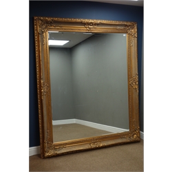  Large rectangular bevelled edge wall mirror in ornate swept gilt frame, 170cm x 200cm  
