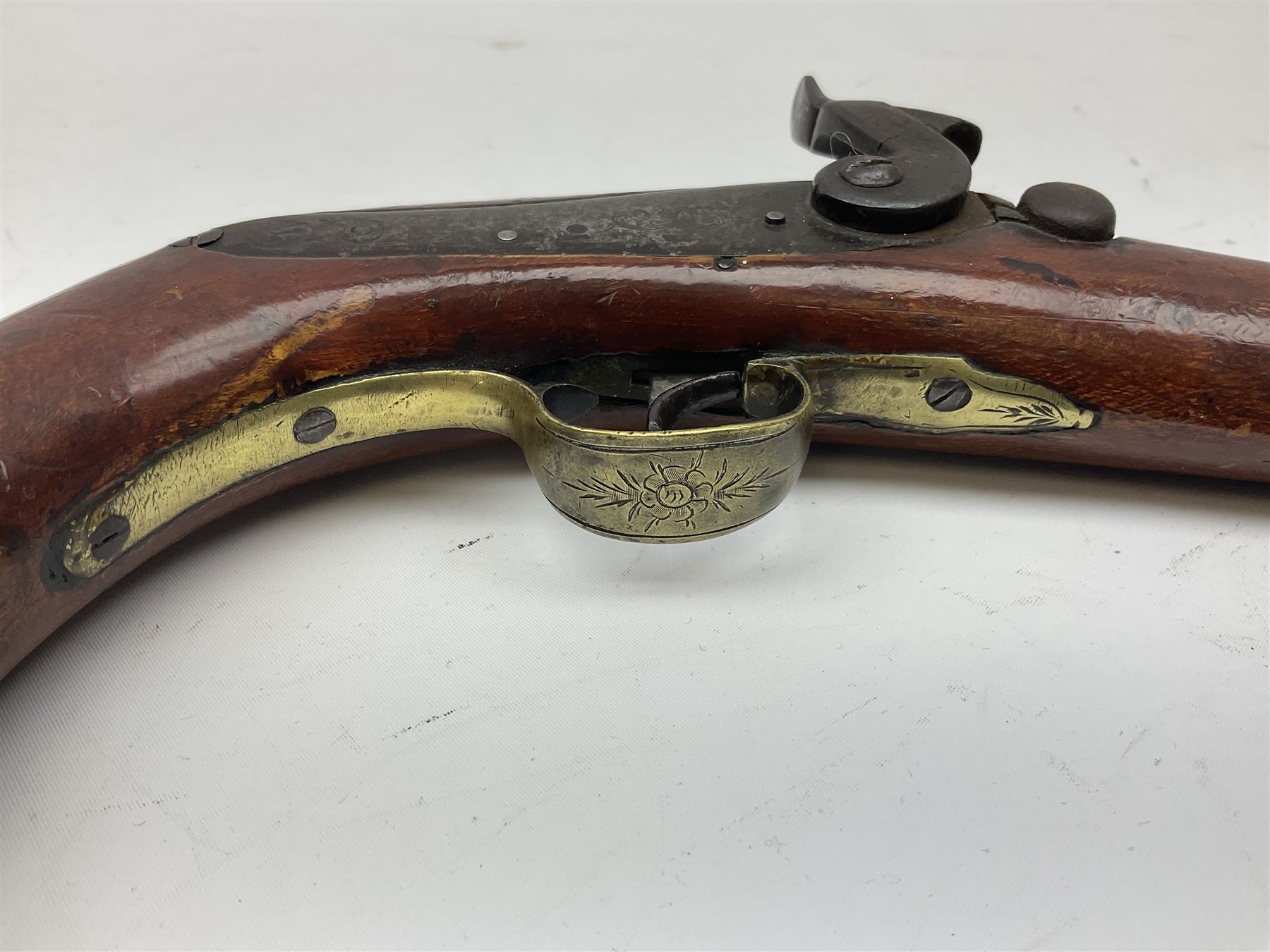 Re-manufactured percussion converted from flintlock single barrel pistol, the 20cm barrel with ramrod under, reused back action lock, brass furniture and hardwood stock L41cm overall