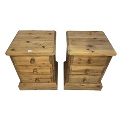 Pair pine bedside chests, square top over three drawers, on plinth base