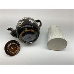 A 19th century Barge Ware teapot, decorated with applied floral sprays and thistles against a mottled brown ground, and plaque detailed Catherine Taylor God Bless Our Home 1890, H18cm, together with a white glazed puzzle mug, H15cm. 