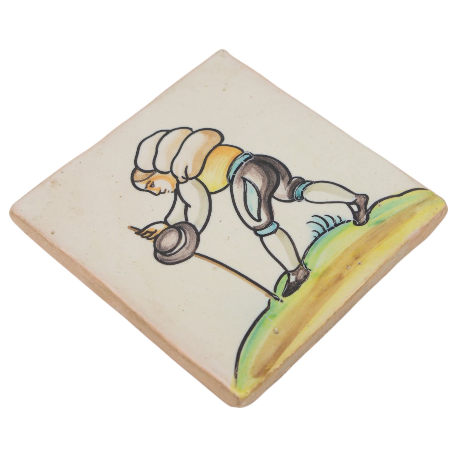 Pair of 20th century continental tin glazed tiles, of a man and a woman in traditional dress, H15cm