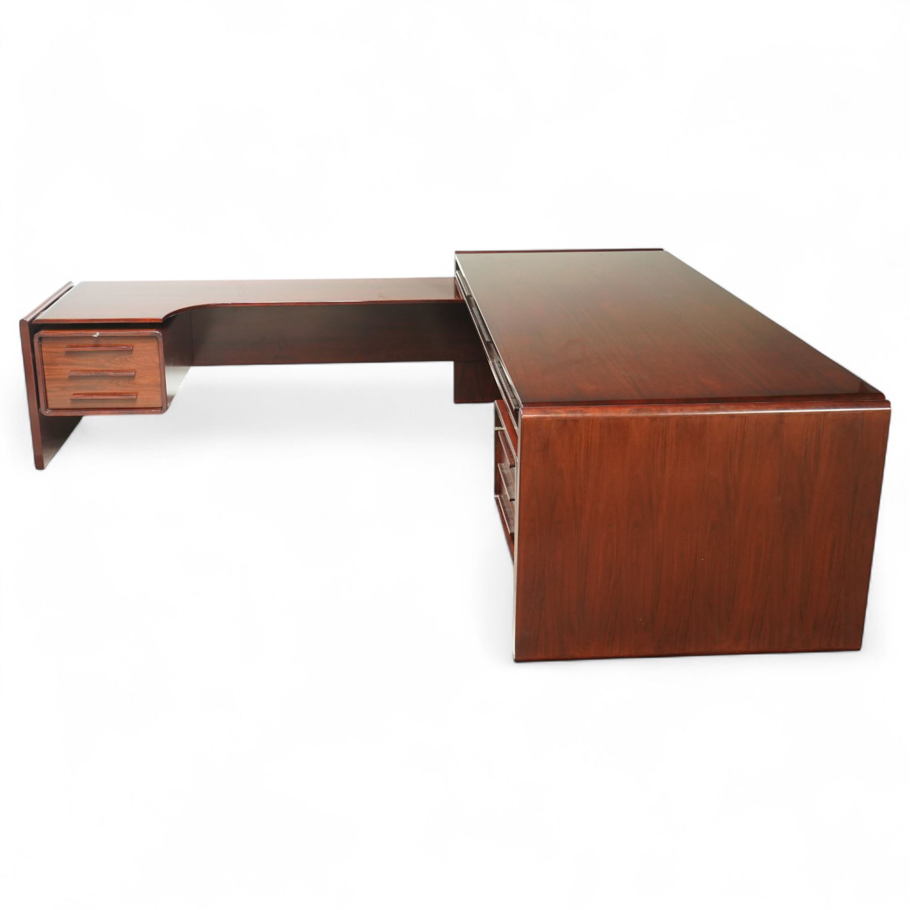 Dyrlund - contemporary Santos rosewood executive desk set, main desk with a rectangular top and leather writing pad above, floating drawer unit with right-angled desk unit top with document tray above a filing drawer 

Note: Dyrlund is a Danish furniture manufacturer known for its high-quality, handcrafted pieces, particularly in the mid-century modern style. Founded in 1960 by Frits Hjerte Dyrlund in Rude, Denmark, the company has remained a family business, now run by the second and third generations. Dyrlund specializes in both home and executive office furniture, focusing on practicality, solid construction, and classic design