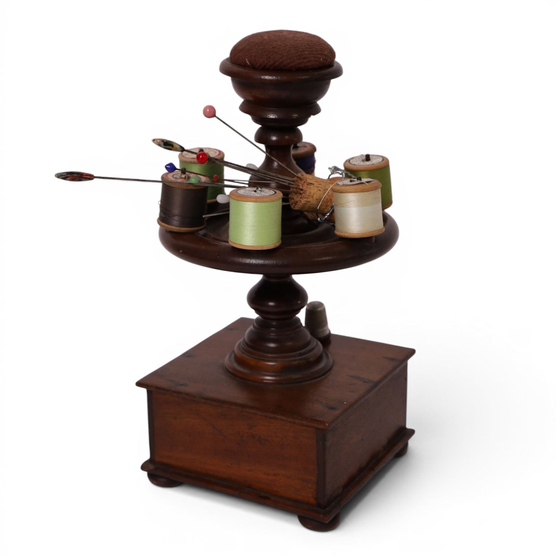 Victorian mahogany bobbin stand, together with pin wheel pin cushion, hat pins other sewing related items, stand H32cm