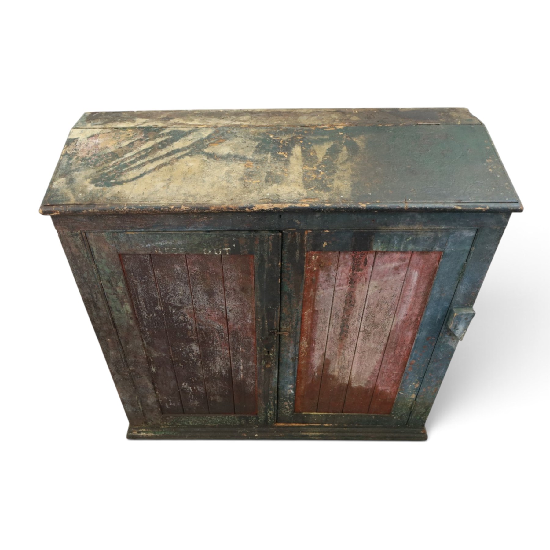 19th century painted and lacquered pine clerks desk bureau on cupboard, hinged fall-front enclosing three compartments, over slatted panelled doors enclosing two perforated shelves, on skirted base, in rustic forest green and red finish