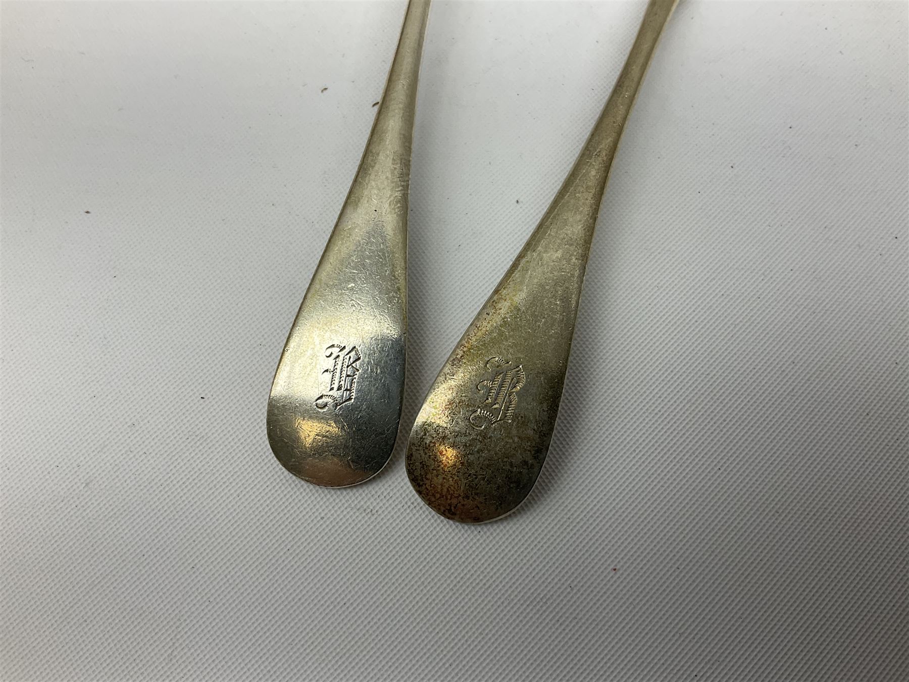 Two small silver page markers in the form of trowels, both hallmarked, together with a small silver and enamel dish, decorated with central panel of flowers, with London import mark, and a small group of flatware, to include Victorian salt spoon, approximate gross weight 111.6 grams