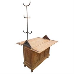 Musgrave & Co Ltd (Belfast) - late 19th century pine saddle horse, with three drawers to one end and cupboard door to the other, the hinged top opening to form a table, the cast iron plaque bears the Royal coat of arms and maker's name