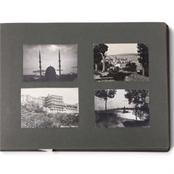 Two early to mid 20th century postcard albums, containing black and white and colour postcards of France, Turkey and Egypt, together with some personal photographs and newspaper clippings