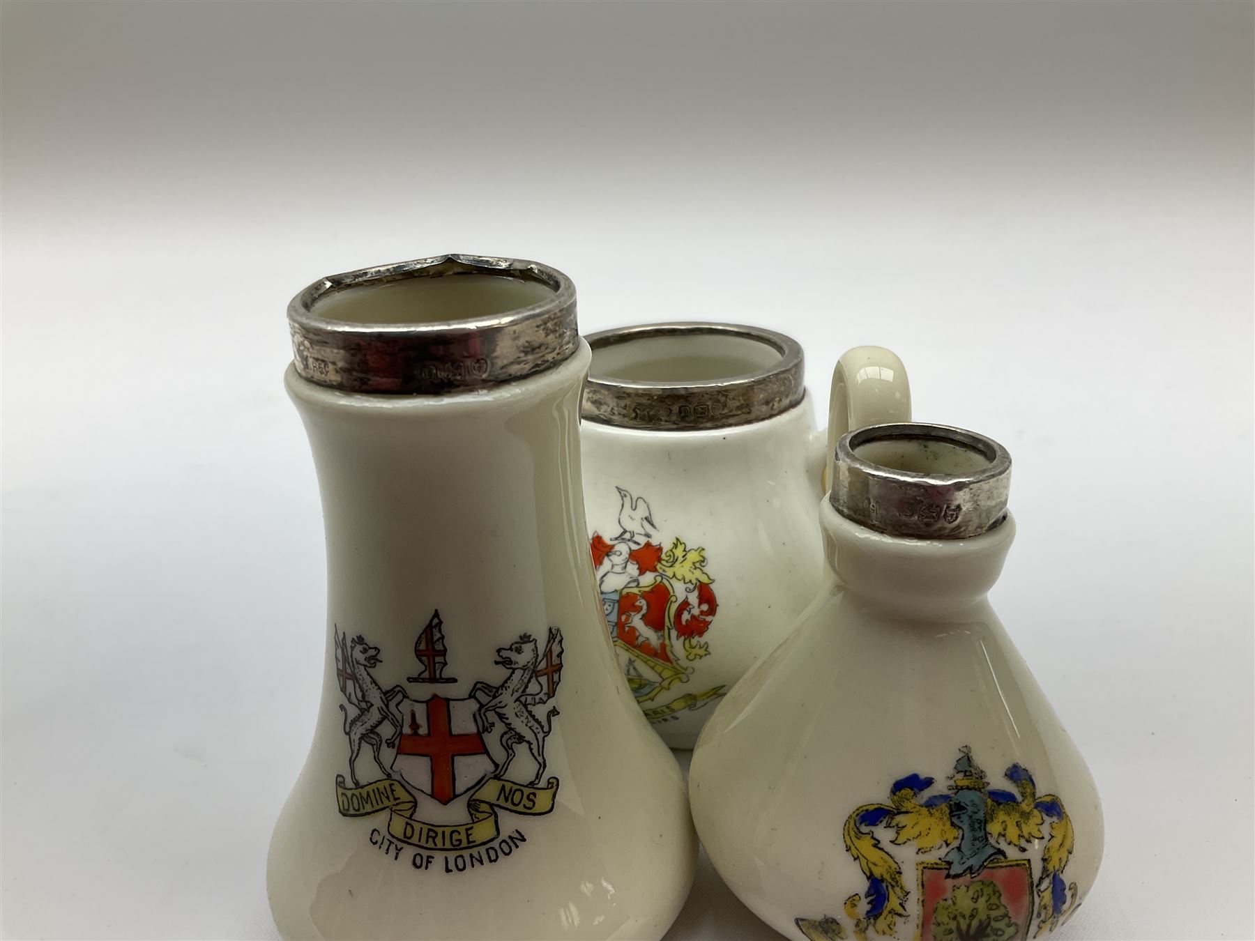Group of silver mounted glass scent bottles and crested ware, together with a Brierglass lead crystal box with a glass and silver, lid, etc all silver with various hallmarks. 