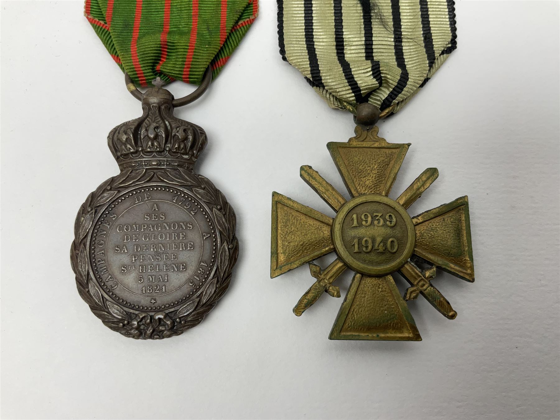 Four French medals - St. Helena medal with bust of Napoleon to obverse and inscription to reverse 'Campagnes de 1792 a 1815. A ses compagnons de gloire sa derniere pensée Ste. Hélène 5 Mai 1821', established by Emperor Napoleon III in 1857; two WW2 Croix-de-Guerre; and WW2 Croix-du-Combattant; all with ribbons (4)