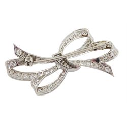 Platinum and white gold diamond bow brooch, the double ribbon bow set with graduated round brilliant cut diamonds and tied with baguette cut diamonds
