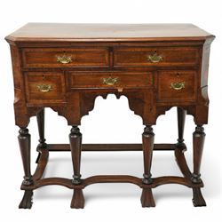 William and Mary design 18th century walnut and yew wood dresser or console table, rectangular canted top with feather banding and moulded edge, over two long and three short cock-beaded drawers, flanked by chamfered uprights above a shaped and cock-beaded apron, raised on six turned and tapering supports united by a shaped box stretcher, on lobed feet 