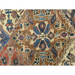Caucasian pale ground rug, the field divided into lozenges each decorated with stylised plant motifs, the guarded border decorated with repeating flower heads 