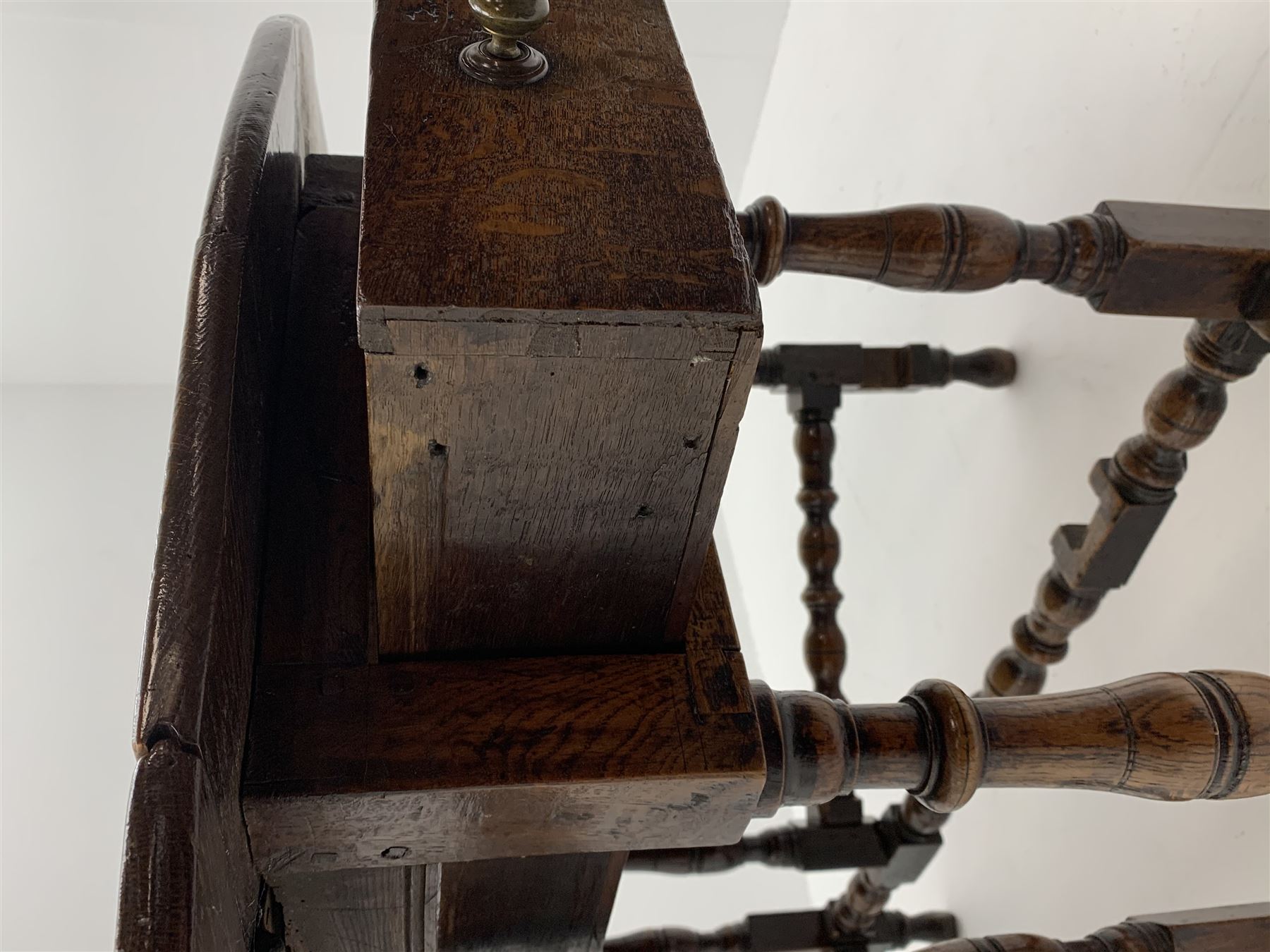 Late 17th century William & Mary oak drop leaf dining table, oval drop leaf top, single drawer to one end, gate action base, turned supports joined by bobbin turned stretchers, 121cm x 135cm, H75cm (open)