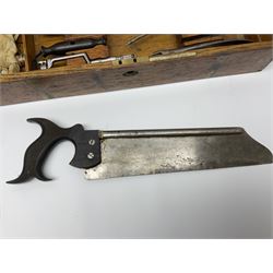 Naval doctor's surgical instruments, contained in a converted brass bound oak pistol box, the hinged lid opening to reveal two removable fitted trays, containing 19th century and later saws, scalpels, tweezers etc