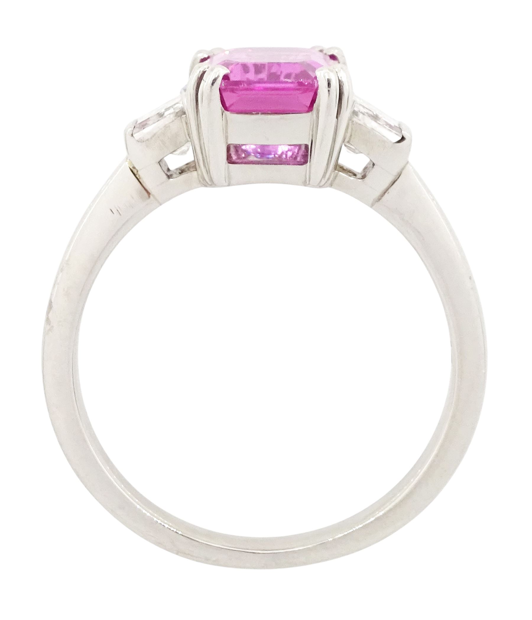 Platinum unheated pink sapphire and diamond three stone ring, emerald cut unheated sapphire of approx 3.16 carat, with a single trapeze cut diamond set either side, London 2014, total diamond weight approx 0.71 carat, with Alan Poultney Gems report, the sapphire with The Gem & Pearl Laboratory report