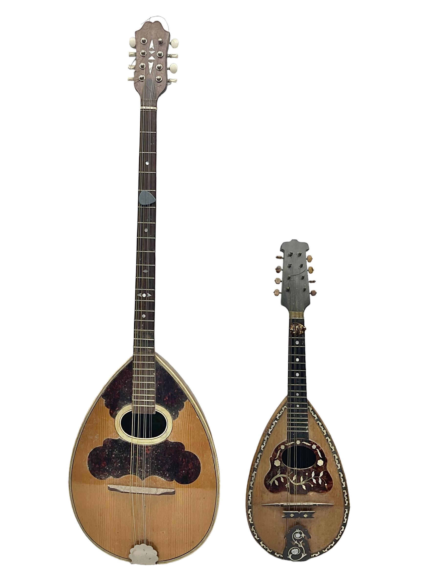Italian bouzouki type long necked mandolin with segmented lute back and spruce top with tortoiseshell style panels; bears label 'Miroglio & Figli Sicilia Catania Italia' L99cm; and Italian lute back mandolin with segmented back and spruce top bearing label for F. De Mureda Napoli (2)