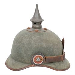 WWI Prussian 22nd regiment Ersatz Felt Pickelhaube, the grey felt skull with steel spike finial, 22 helmet plate and leather chin strap, one side with a black cockade, the other black and red,  the inner back brim stencilled BA 1X Wm Kleddinghaus & C, Elberfeld, 1916, H24cm