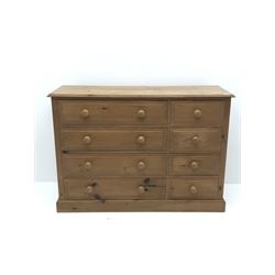 Polished pine chest of drawers, Projecting cornice, four long and four short drawers, platform support