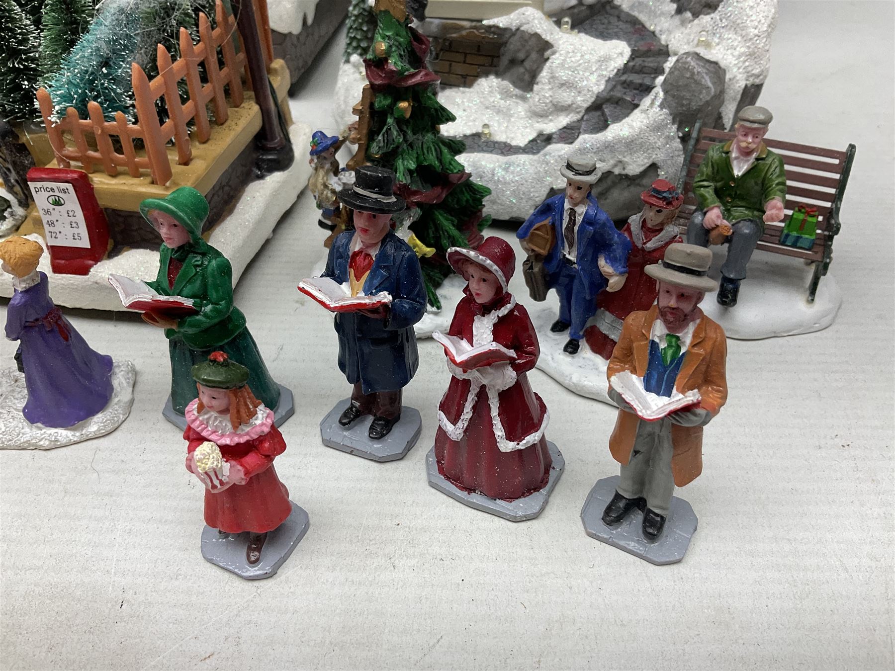 Christmas decorations; Premier LED Christmas Village scene with moving train, together with three Lumineo christmas scenes, and other similar 