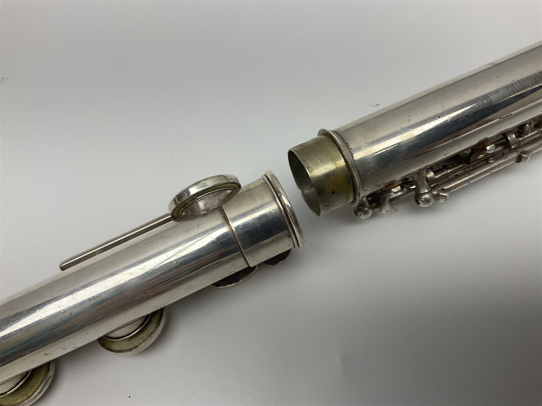 Boosey & Hawkes London Regent three-piece flute, serial no.345447; in B&H Bandhite hard carrying case; and Deg Music Company Inc. USA Claudel Model three-piece flute, serial no.491718, in hard carrying case (2)
