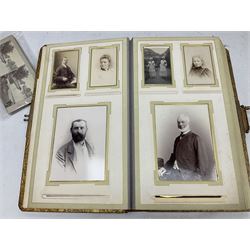 Victorian photograph album with ornately gilded and hand painted covers and brass clasp, partially stocked with Victorian and later portraits etc; another well stocked Victorian leather bound photograph album relating to the Cawood family; three other Victorian leather bound photograph albums; and small quantity of stereoscopic cards