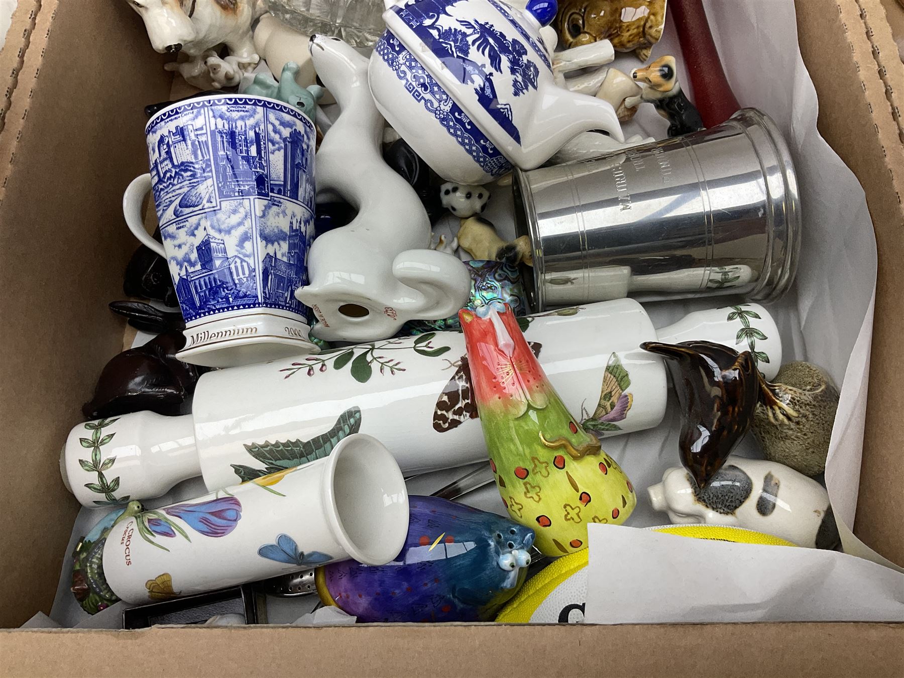 Quantity of various ceramics and glassware to include pair of Disney Mickey and Minnie Mouse cowboy Sherriff figures, stamped Japan beneath, Mason's ironstone, Wedgwood, Portmeirion, tea and dinner wares, collectors plates, glass animals etc in four boxes