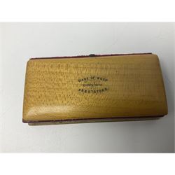 Six sewing related Mauchline ware comprising an oval reel box with internal label for Clark & Co's, tape measure, pin case and three thimble holders of ovoid form 