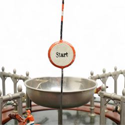 Marklin tin plate lever operated horse racing game with nine numbered horses slotted into tinplate track, wooden box with lift off lid 36cm square