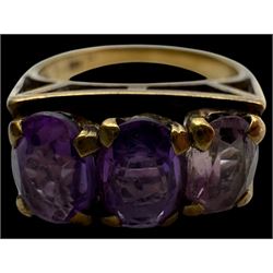 Two pairs of 9ct gold hoop earrings, three 9ct gold earring backs and an 8ct gold three stone ring