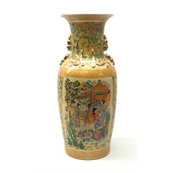 A large japanese vase, the yellow ground decorated with figural panels containing geishas within a mountainous landscape with pagodas in the background, heightened throughout with gilt, H58cm. 