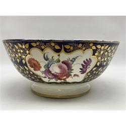 19th century continental bowl, decorated with hand painted floral sprays amongst gilt foliate decoration on a cobalt blue ground, D27.5cm