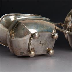 Early 20th century three piece silver tea service, comprising teapot, open sucrier and milk jug, all with oblique gadrooned rim, engraved initial to body and upon four bun feet, the teapot with Bakelite type handle and finial, hallmarked Walker & Hall, Sheffield 1912, contained within an oak presentation case with silk lining