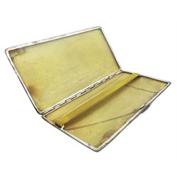 Mid 20th century silver cigarette case, of rectangular form with engine turned decoration to the whole, and vacant rectangular panel to upper left corner, hallmarked Harman Brothers, Birmingham 1961, H17cm, approximate weight 7.2 ozt (224 grams)