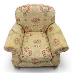 Parker Knoll - 'Henley' floral fabric living room suite, comprising a two seat sofa and pair of armchairs, raised on dark stained turned feet raised on brass castors

Armchairs (H 99cm, W 95cm, D 100cm)