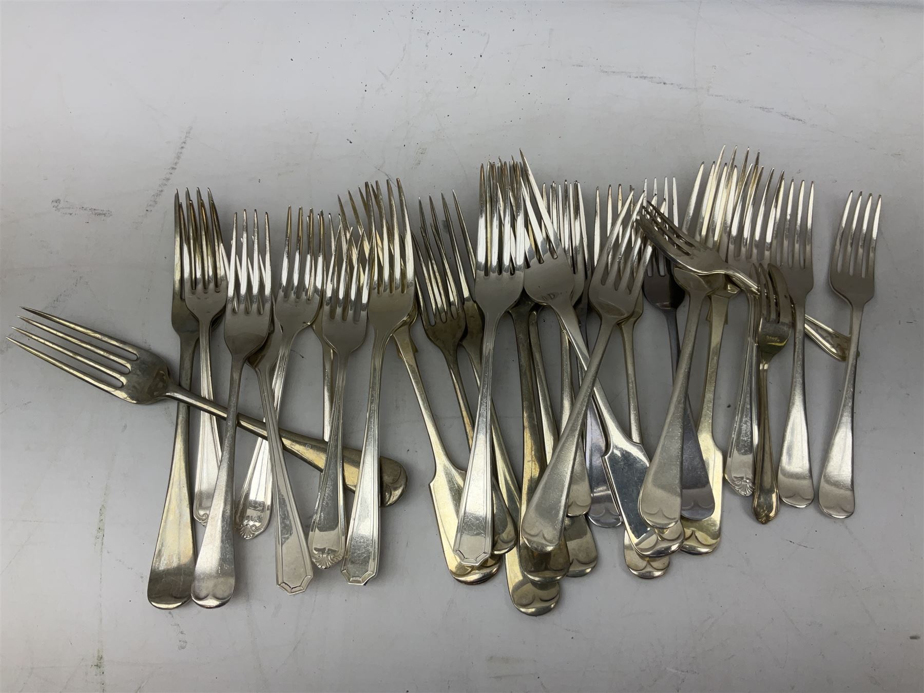 Four butter knives with hallmarked silver handles together with a Quantity of silver-plated cutlery stamped Ashberry and other stainless steel cutlery