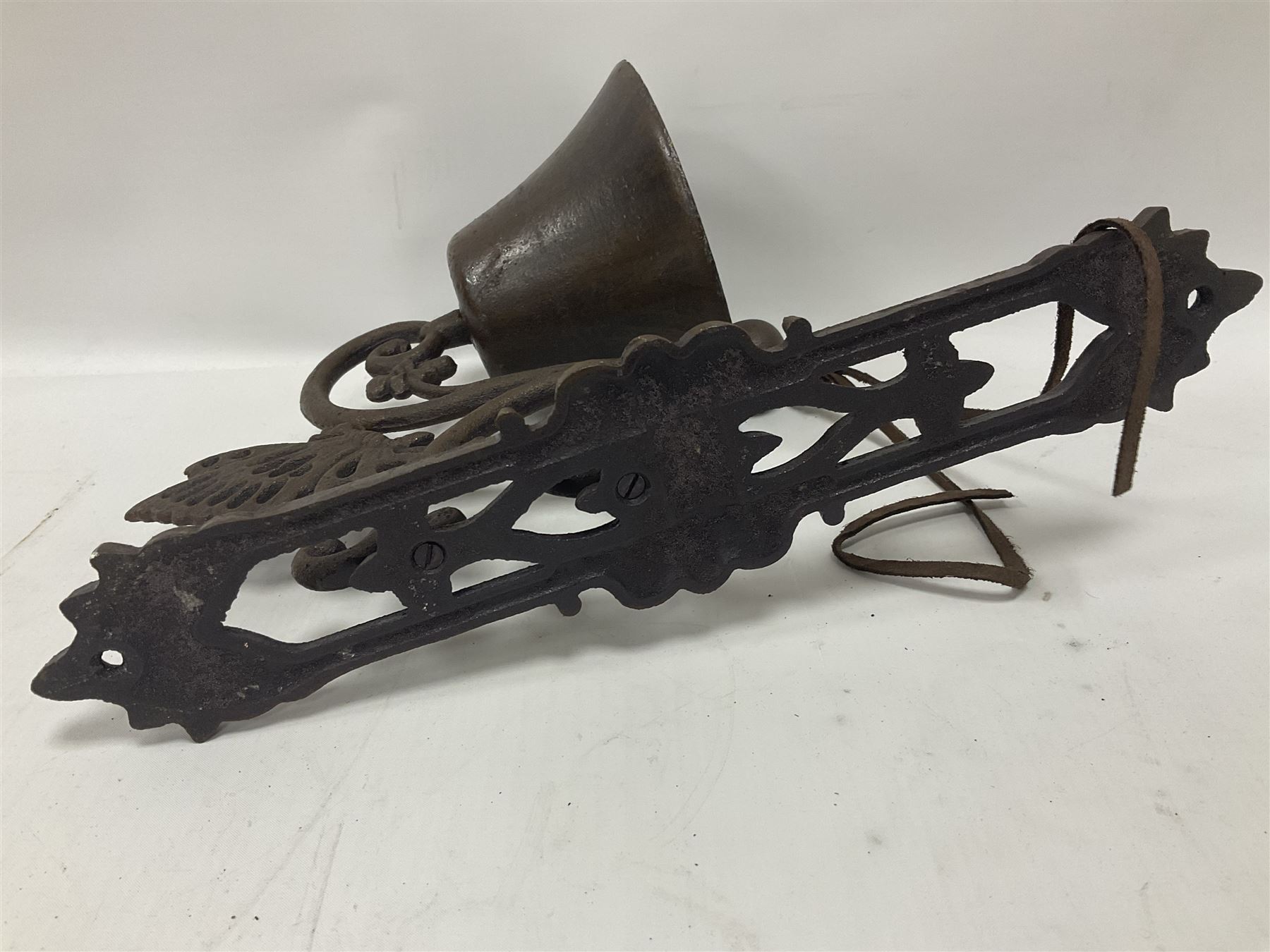 Cast iron exterior hanging garden bell with decorative butterfly bracket