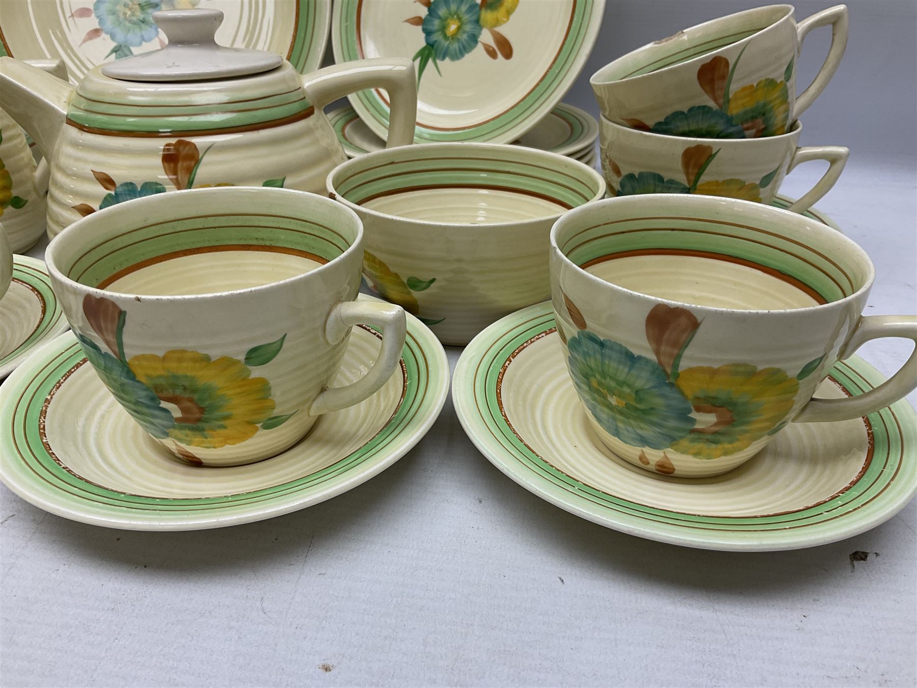 Wilkinson Clarice Cliff honeydew pattern tea service for eight, comprising teapot, milk jug, open sucrier, teacup and saucers, dessert plates and two side plates (29)