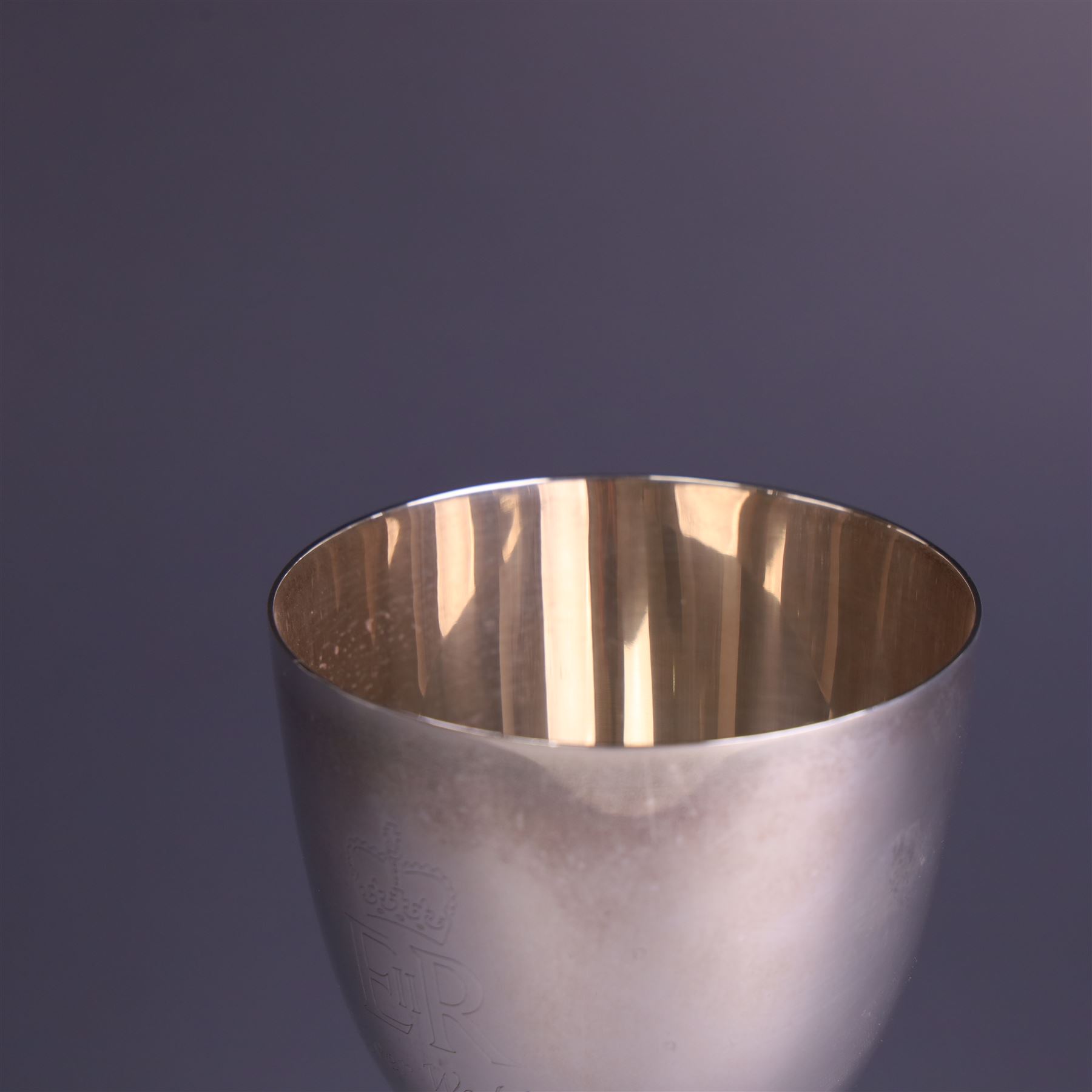 Late 20th century limited edition silver goblet, produced by Garrard & Co Ltd  to commemorate the silver wedding anniversary of Her Majesty Queen Elizabeth II and His Royal Highness the Duke of Edinburgh, the bowl engraved with Royal cyphers and anniversary dates, upon a knopped stem and embossed foot, no. 77/2000, hallmarked Garrard & Co Ltd, London 1972, H15cm