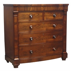  Victorian figured mahogany bow front chest, a frieze, two short and three drawers, with turned rosewood handles, enclosed by tapering pilasters, on bun feet, with key, W120cm, H117cm, D55cm  