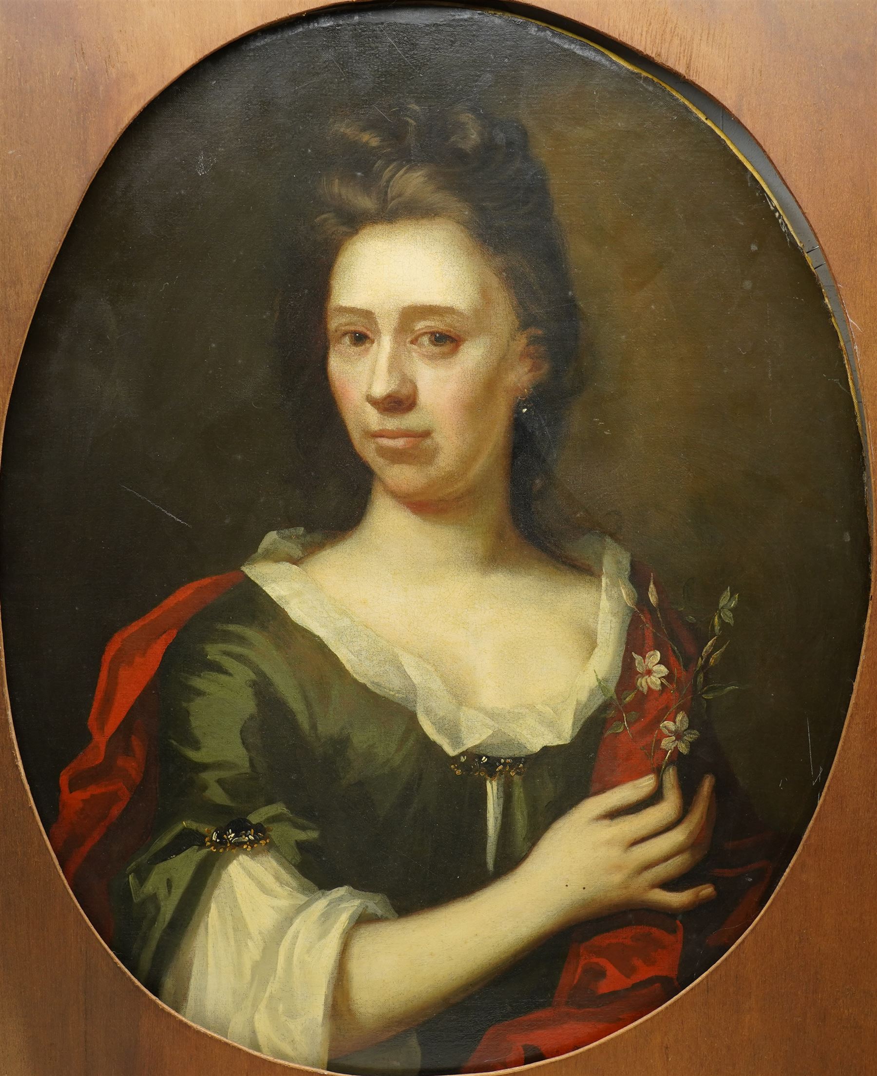 Circle of Michael Dahl (British/Swedish 1659-1743): Portrait of a Lady with Flowers, early 18th century oval oil on canvas unsigned 75cm x 61cm