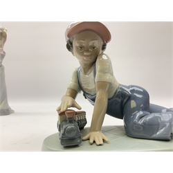 Four Lladro figures, comprising Eskimo Playing no 1195, Best Friend no 7629, All Aboard no 7619 and Constance no 6117, all in original boxes, largest example H24cm
