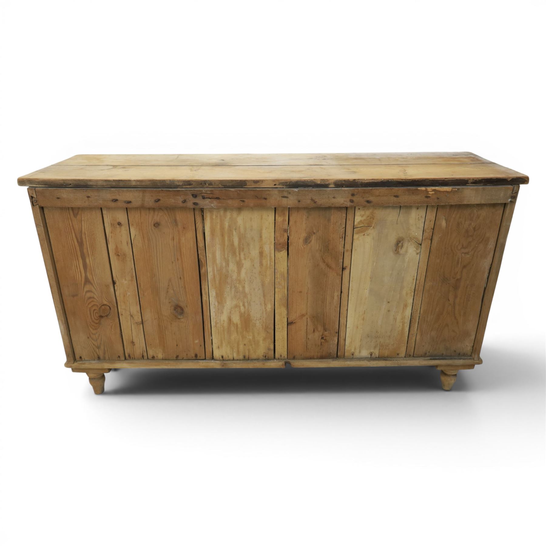 Victorian waxed pine farmhouse dresser, featuring seven drawers with central cupboard, moulded glass handles, raised on turned feet