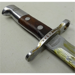  German Bayonet, twin edge fullered blade marked Waffenfabrik Neuhausen, crosspiece stamped 879300, part wooden grip, in steel scabbard, L45cm   